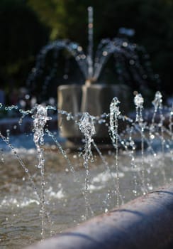 Water stream splashing on ground, Water drops watering, close up