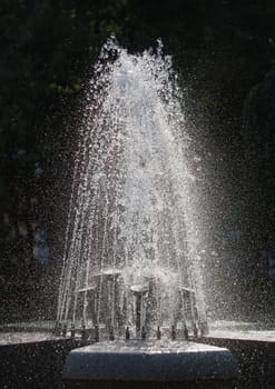 Water stream splashing on ground, Water drops watering, close up