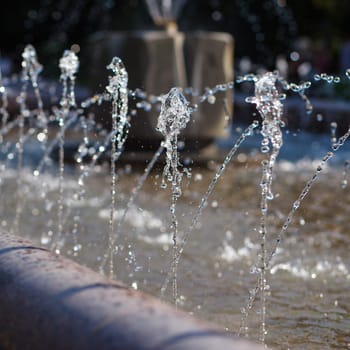 Water stream splashing on ground, Water drops watering, close up