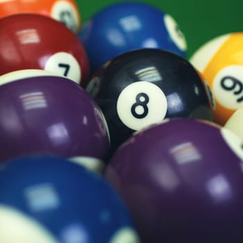Different points of view billiard balls on a blue pool table. eight in focus