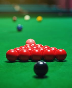 red snooker balls set on a green table, billiards game