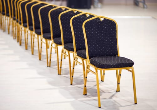 Row of chairs in office meeting room