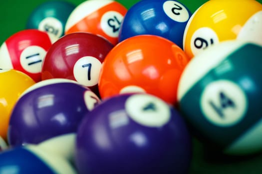 Different points of view billiard balls on a blue pool table, seven in focus