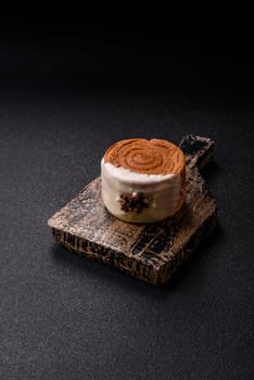 Round sweet New York roll croissant with pistachio cream filling on a dark concrete background