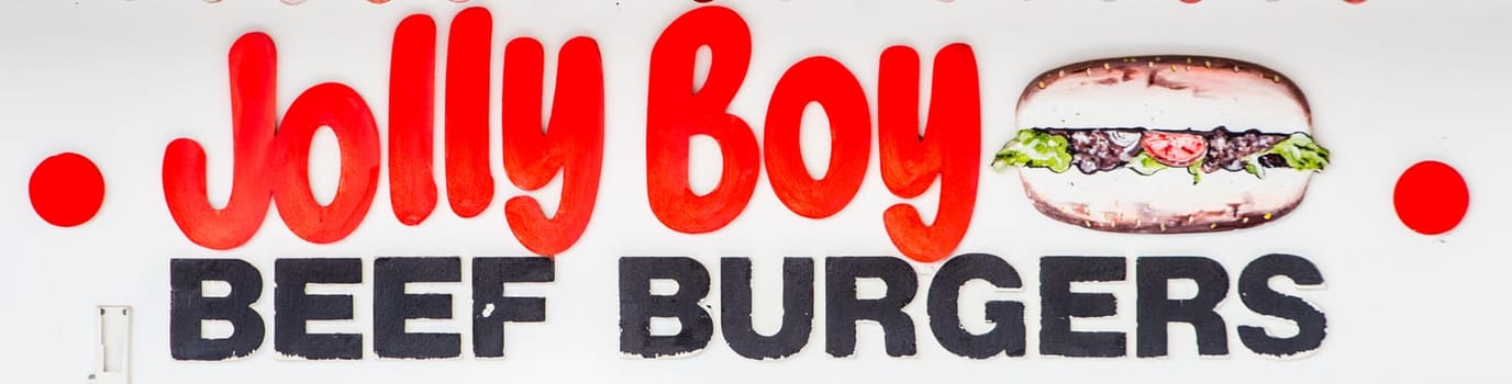 Sign at a Carnival kiosk advertising Jolly Boy Beef Burgers