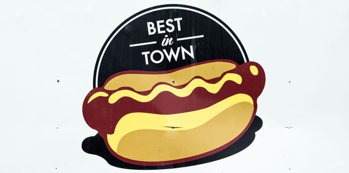 Sign at a Carnival kiosk advertising Hot Dogs and promoting them as best in town