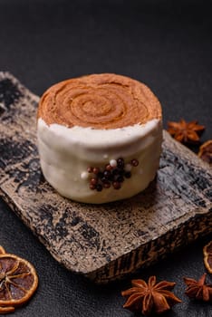 Round sweet New York roll croissant with pistachio cream filling on a dark concrete background
