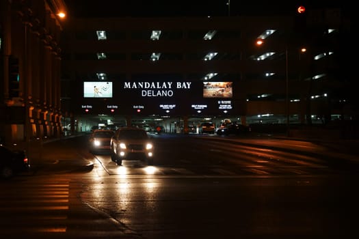 Las Vegas,United States - December 23,2015: Vehicles leave the underpass of the parking lot of the Mandalay Bay luxury hotel and casino on the night of December 23,2015 in Las Vegas.