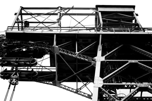A high voltage tower from a steel frame with cable winch platforms.