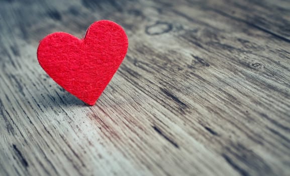 Red heart on the wooden  background, love background