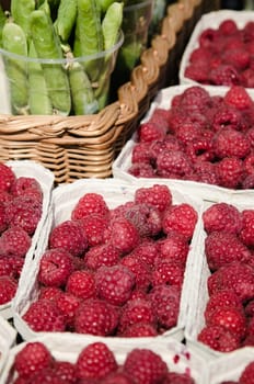 Ripe juicy raspberry in boxes, a close up