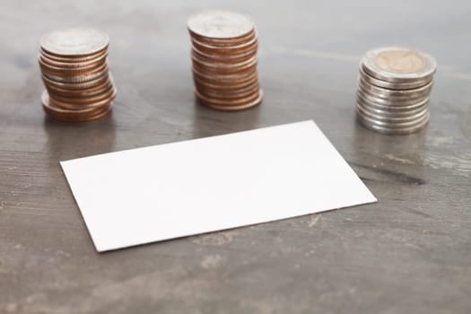 Blank name card with coins, stock photo