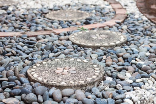 Garden stone path with pebble stone, stock photo