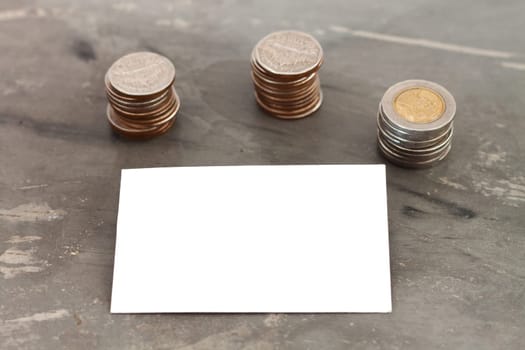Blank name card with coins, stock photo