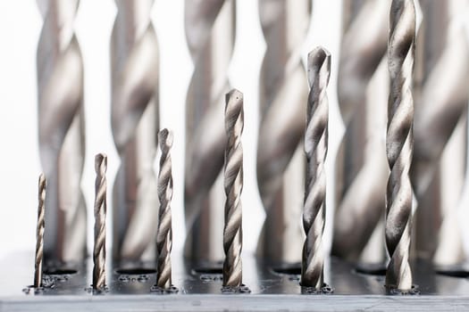 Hard metal screwdriver bits on white background