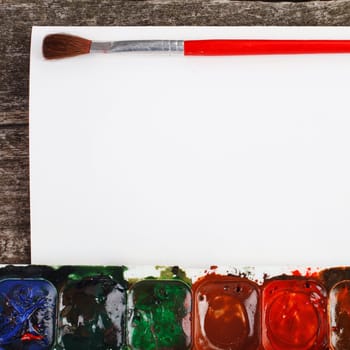 art paints for painting and brush on  vintage wooden background