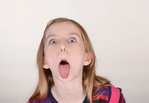 Girl sticks tongue out