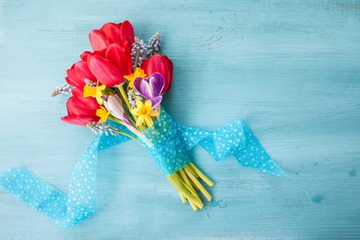 Strauss colorful frugal flowers on a blue background