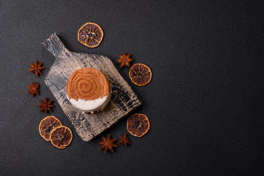 Round sweet New York roll croissant with pistachio cream filling on a dark concrete background