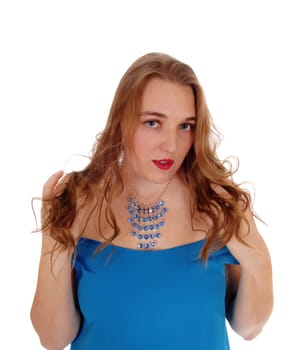 A closeup portrait image of a lovely blond woman in a blue dress and.necklace standing isolated for white background..