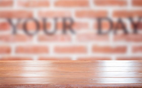Old empty wooden table top with brick wall background, stock photo