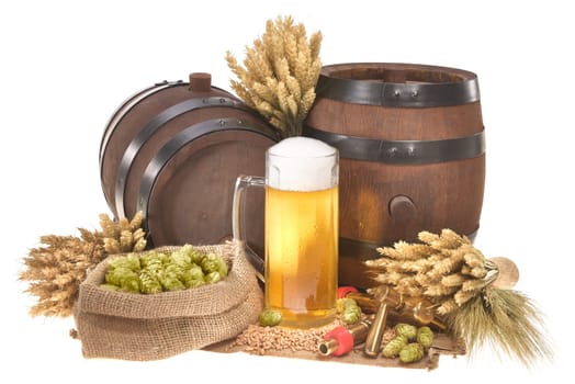 Beer glass and two beer barrels with wheat,barley,hops,malt insulated on white