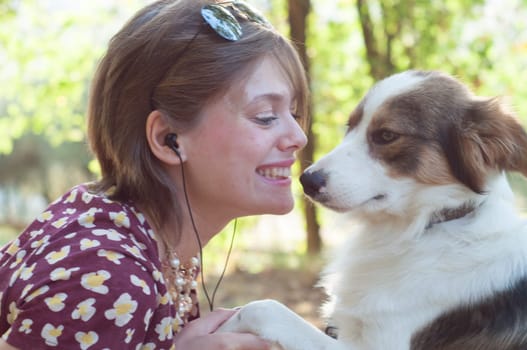 girl and pet dog in a sunny day