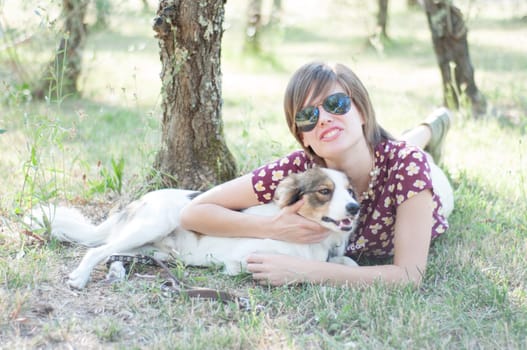 girl and pet dog in a sunny day
