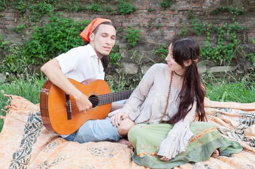guitarist and his girlfriend in a beautiful day