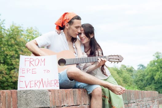 guitarist and his girlfriend in a beautiful day