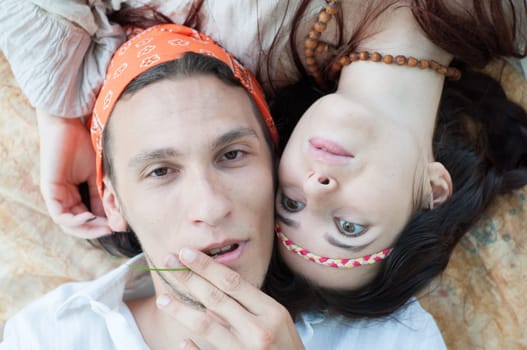 girl and boy hippies in a beautiful background