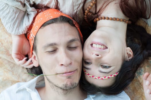 girl and boy hippies in a beautiful background