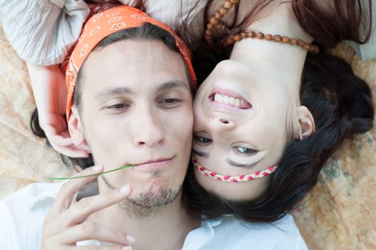 girl and boy hippies in a beautiful background