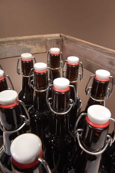 Close-up of many beer bottles with ironing closure in old beer box