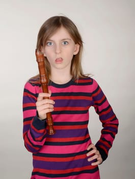 annoyed girl with recorder