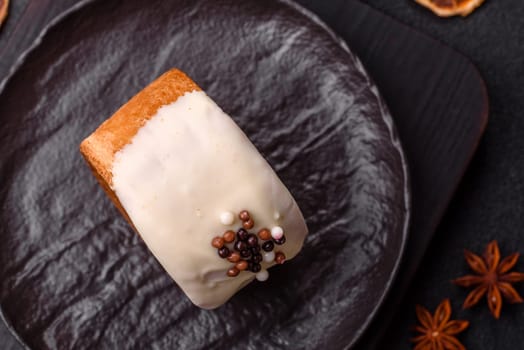 Round sweet New York roll croissant with pistachio cream filling on a dark concrete background