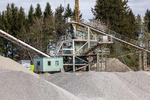 Opencast mining - a gravel pit with conveyor tower