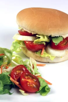 Hamburger rolls with tomatoes,onions and salad and garnished with salad