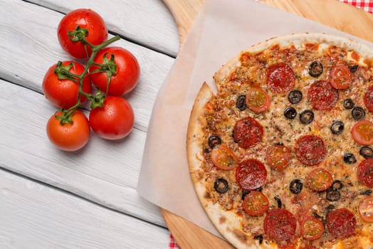 Italian pizza served on wooden table, close-up.