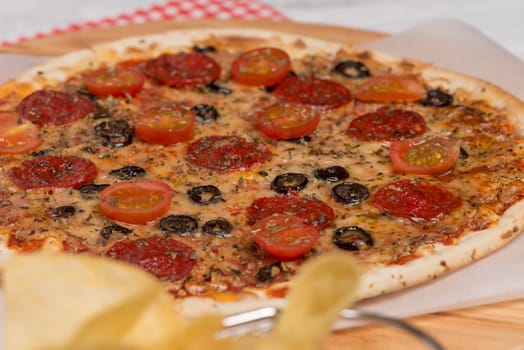 Italian pizza served on wooden table, close-up.