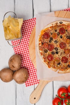 Italian pizza served on wooden table, close-up.