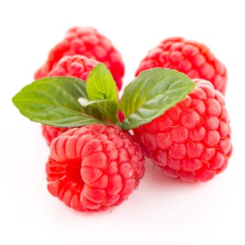 Ripe raspberry with leaf isolated on white background.