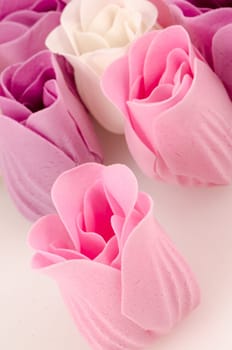 Pink, purple and white beautiful luxury soap roses background.