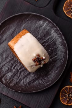 Round sweet New York roll croissant with pistachio cream filling on a dark concrete background