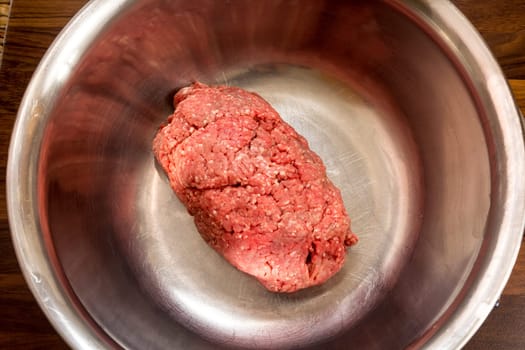 Minced meat in a silver bowl - run to the bulettes! Eggs,onions and spices are also included.