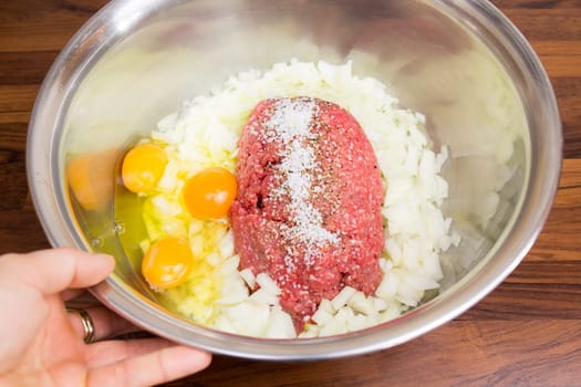 Minced meat in a silver bowl - run to the bulettes! Eggs,onions and spices are also included.