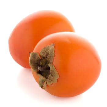 Persimmon fruits on white background.