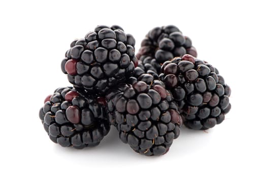 Blackberries with leaves isolated on white background.