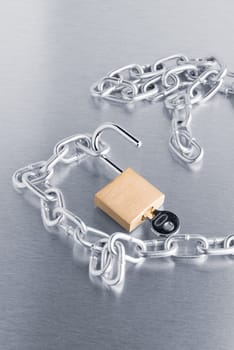 Closeup on silver chain on metal finish background.