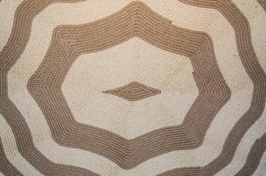 Hanging background image of a hand-woven old carpet with ornament.